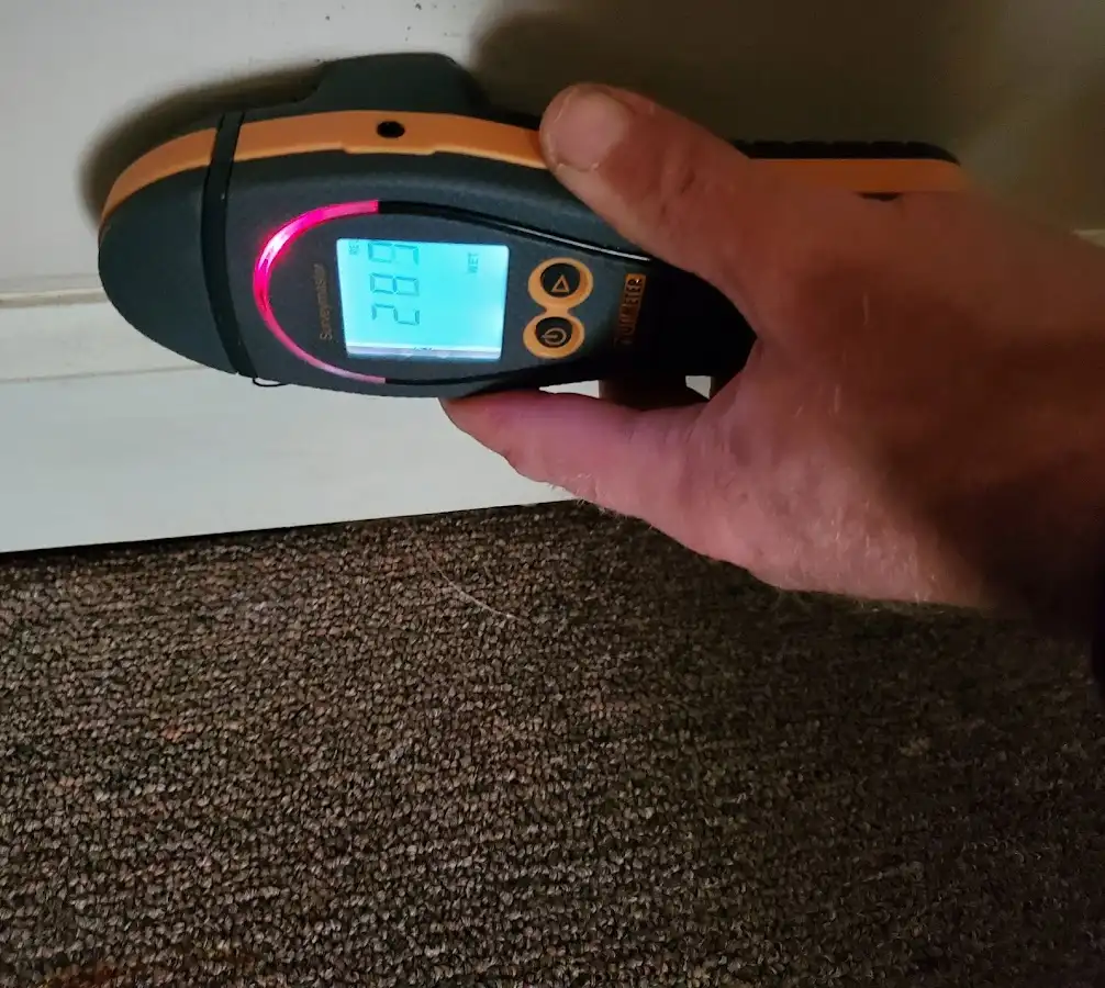 Moisture detection at baseboard during Burst Pipe Cleanup in Miami Lakes